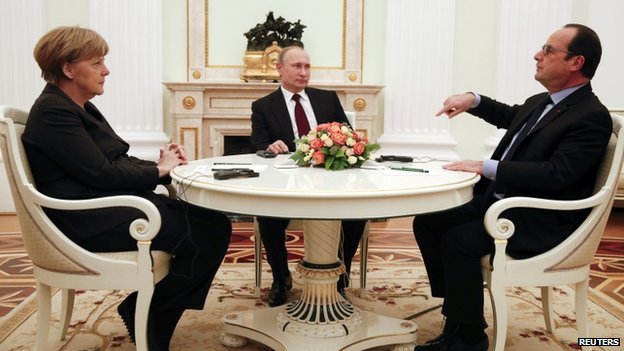 French President Francois Hollande (R) gestures as he speaks with Russian President Vladimir Putin (C) and German Chancellor Angela Merkel (L). Source: BBC News.